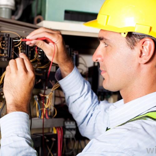 man working on circuit board